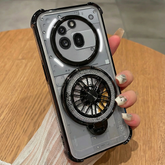 Phone case with decorative ring holder held by a hand on a wooden surface